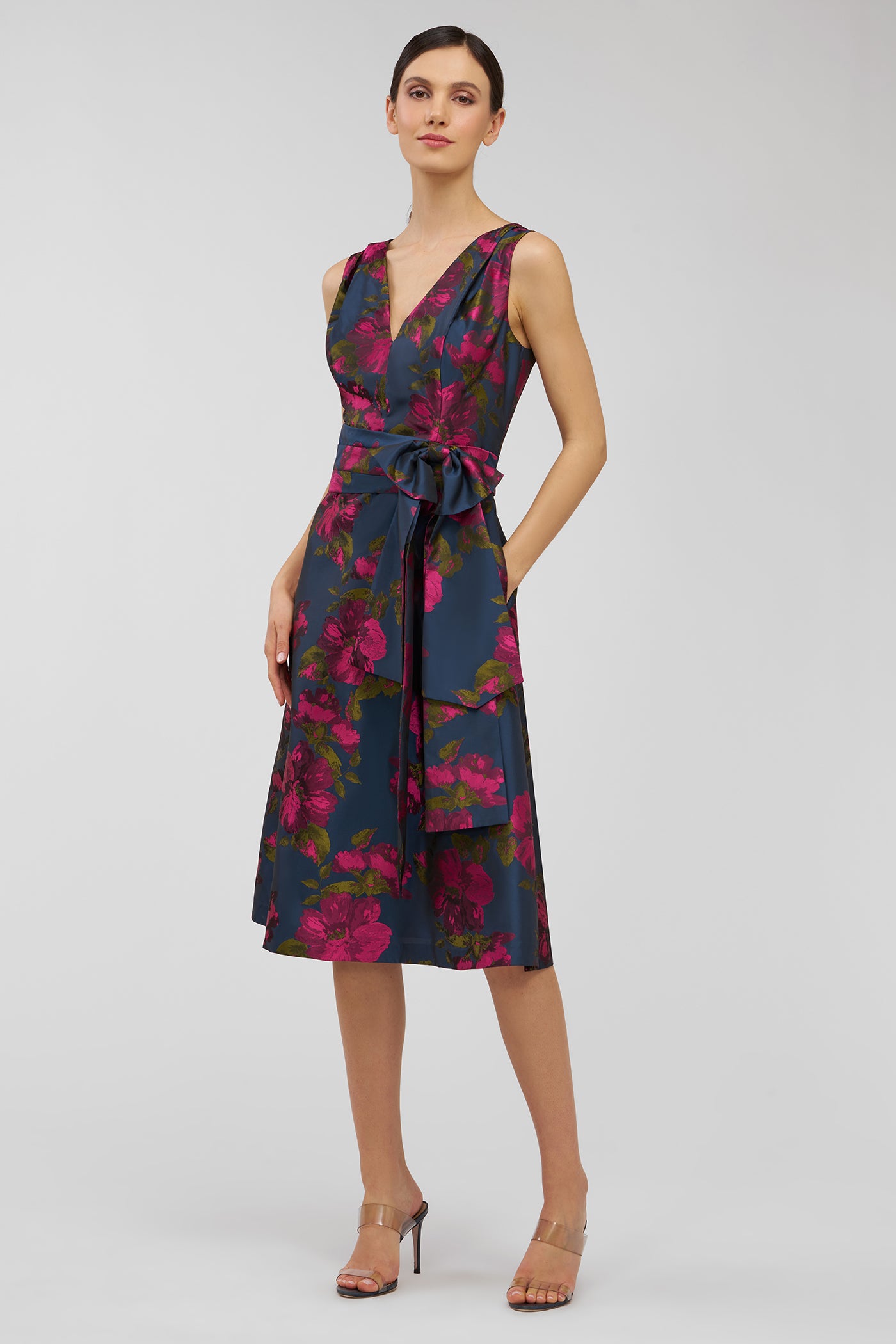 Woman wearing a floral dress on a white background