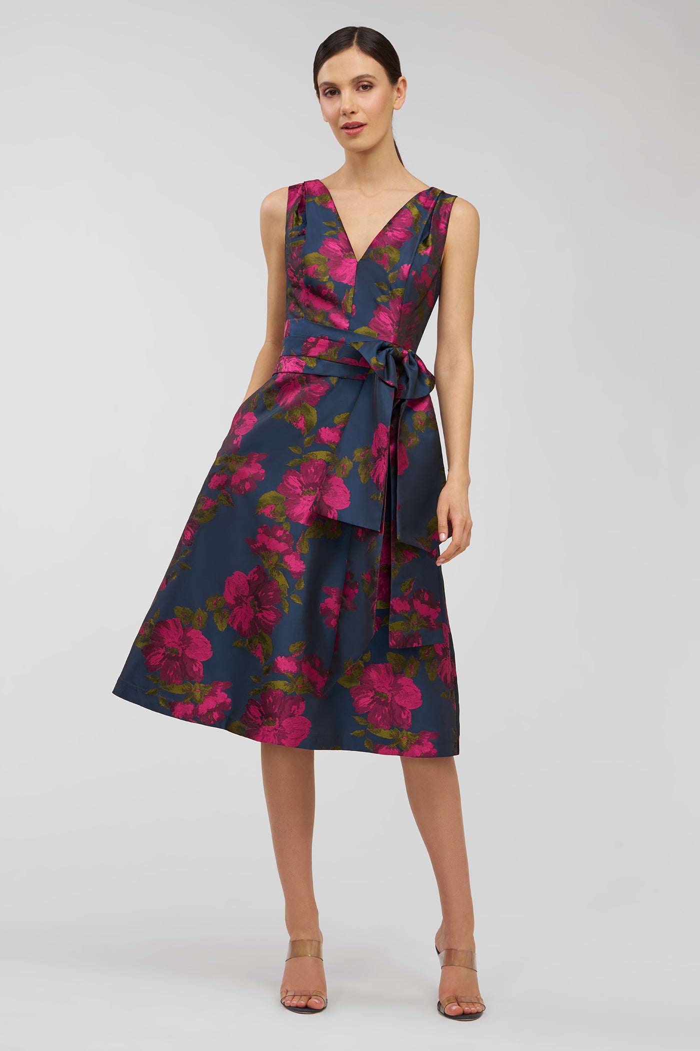 Woman wearing a floral dress on a white background