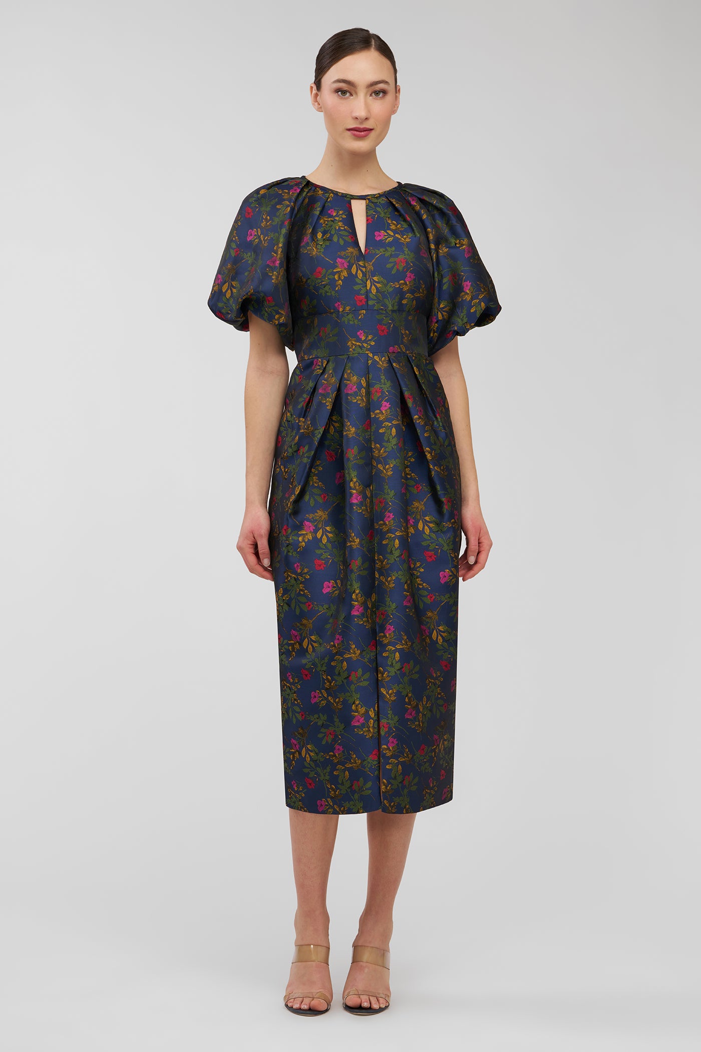 Woman wearing a floral dress on a white background