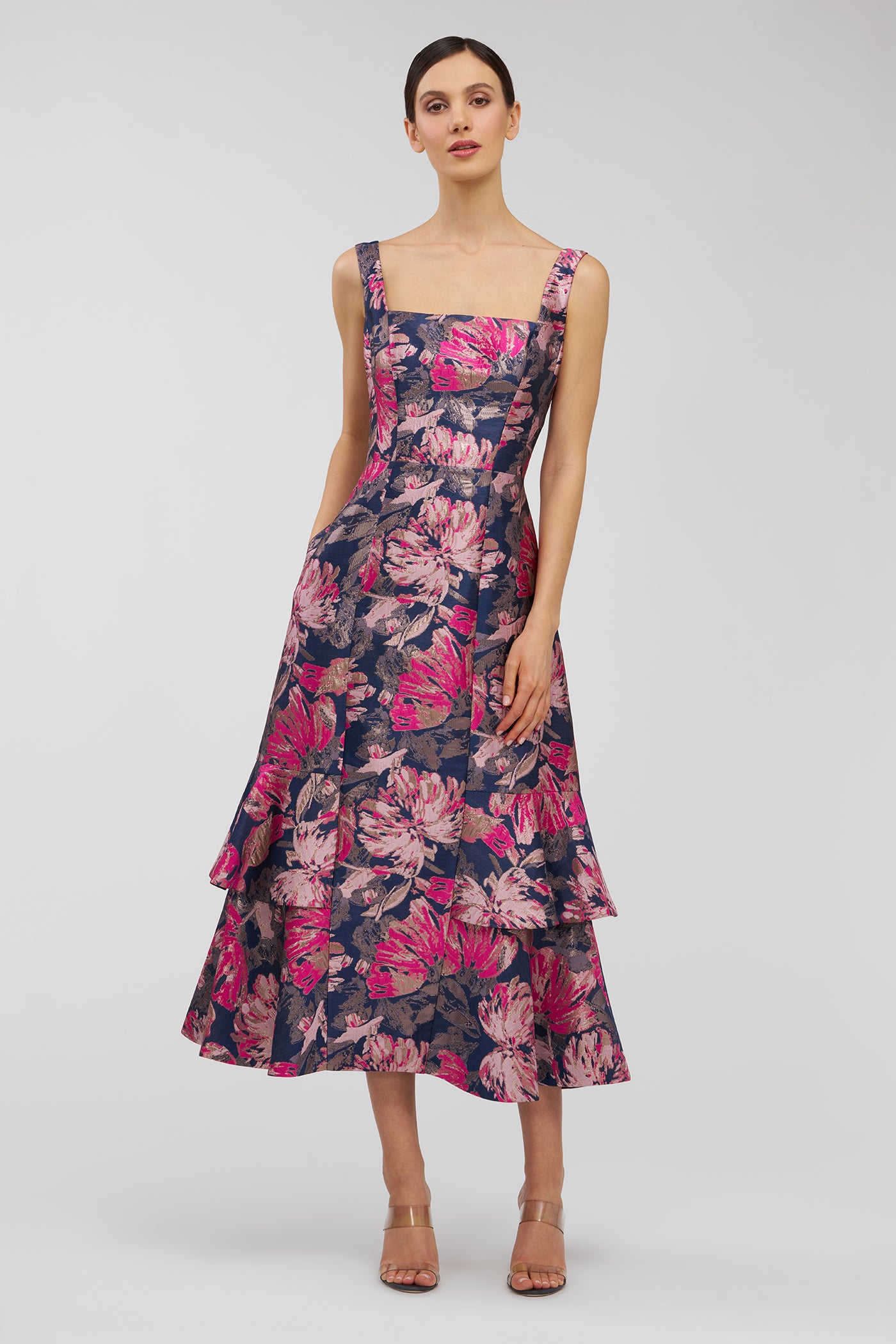 Woman wearing a floral dress on a white background