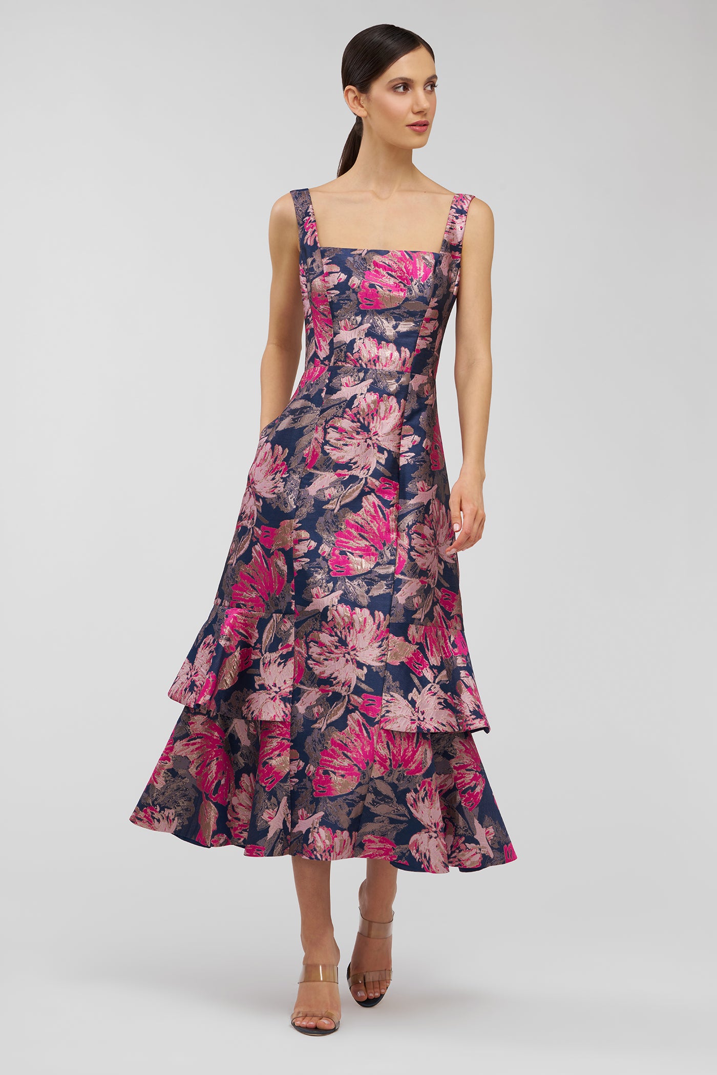 Woman wearing a floral dress on a white background