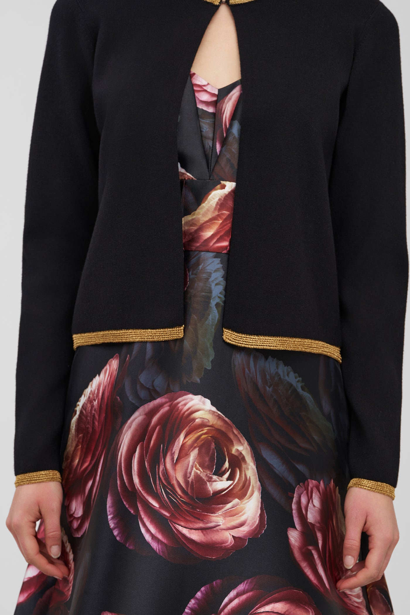 Black jacket with floral design underneath on a white background